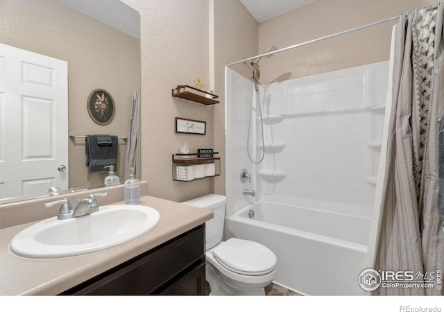 full bathroom featuring vanity, shower / bath combination with curtain, and toilet