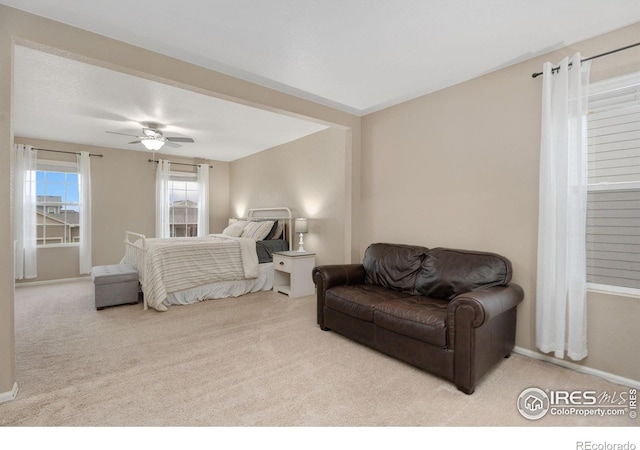 carpeted bedroom with ceiling fan