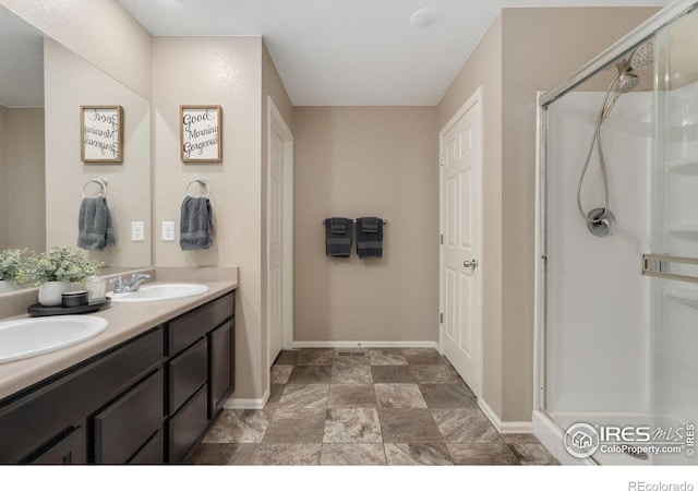 bathroom with vanity and walk in shower