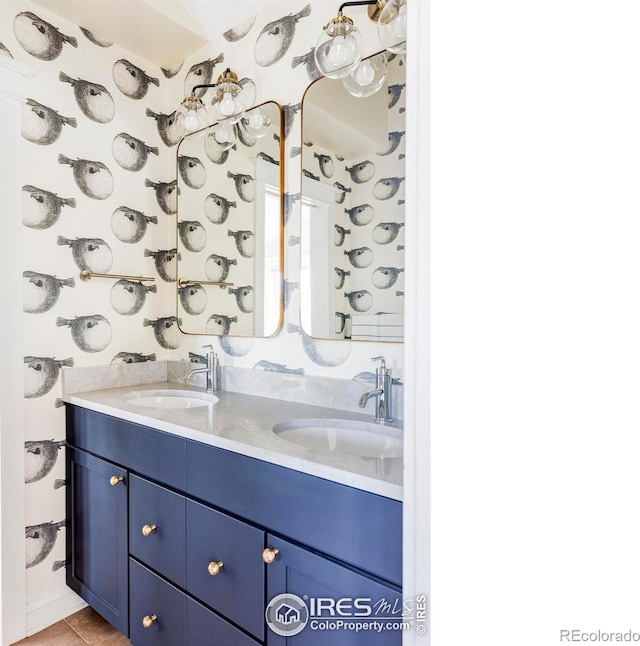 bathroom with tile patterned flooring and vanity