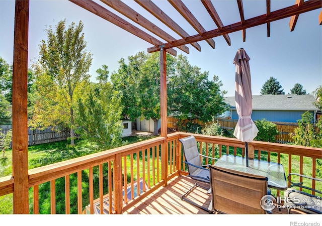 wooden deck featuring a yard and a shed