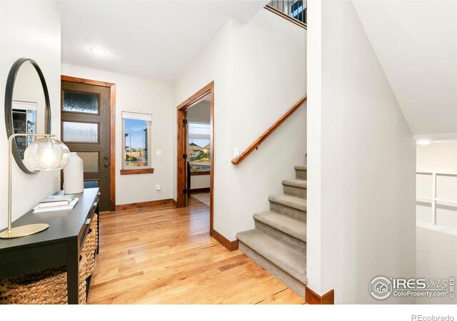 entryway with light hardwood / wood-style floors