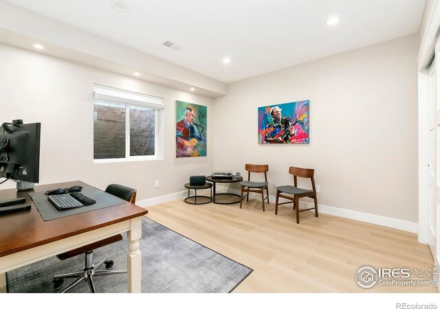 office area with light hardwood / wood-style flooring