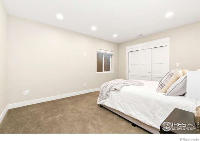 carpeted bedroom with a closet