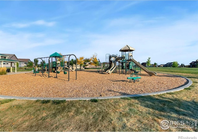 view of jungle gym with a lawn