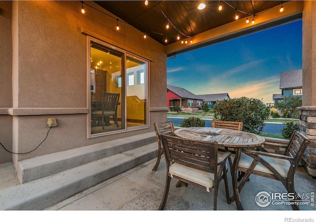 view of patio terrace at dusk