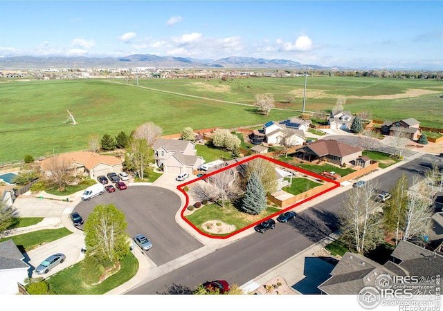 birds eye view of property with a mountain view