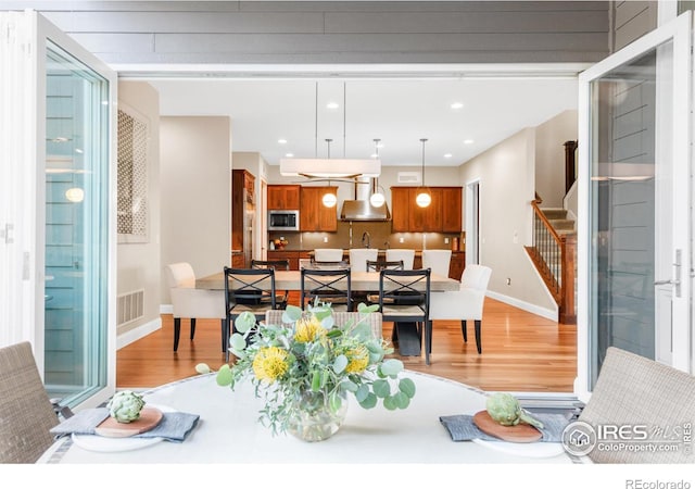 dining room featuring light hardwood / wood-style flooring