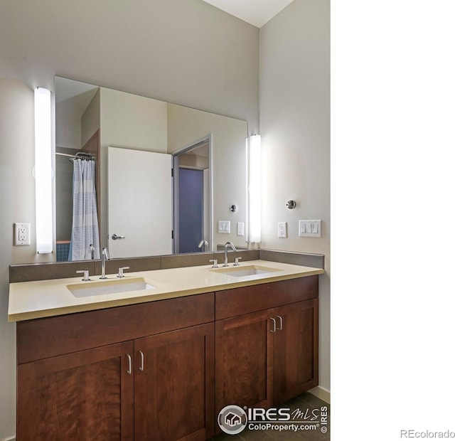 bathroom with tile patterned flooring and vanity