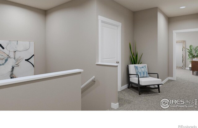 410 High Point Dr Unit 104, Longmont, CO 80504 - hallway featuring light colored carpet