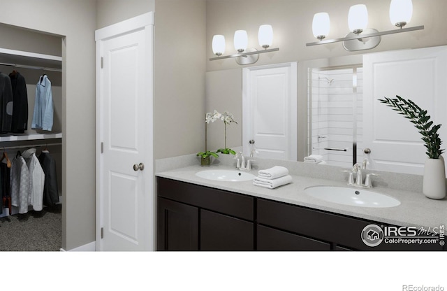 410 High Point Dr Unit 104, Longmont, CO 80504 - bathroom with vanity and a shower