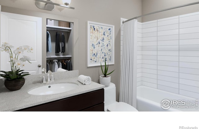 410 High Point Dr Unit 104, Longmont, CO 80504 - full bathroom with vanity, toilet, and shower / bath combo with shower curtain