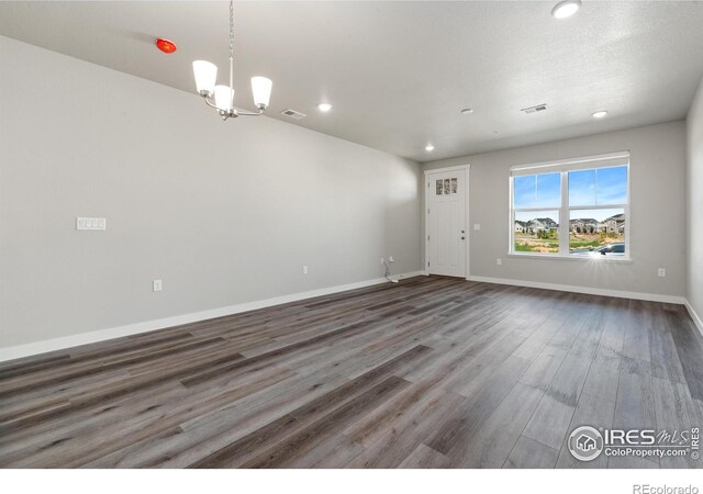 410 High Point Dr Unit 104, Longmont, CO 80504 - interior space with dark hardwood / wood-style flooring and a notable chandelier