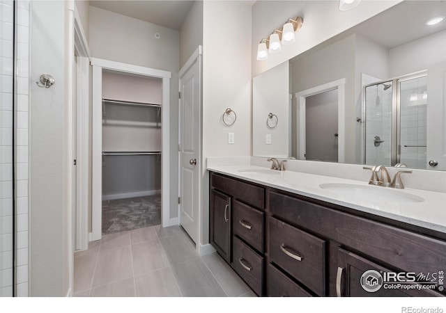 410 High Point Dr Unit 104, Longmont, CO 80504 - bathroom with an enclosed shower and vanity