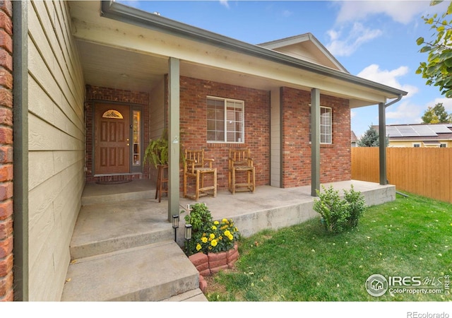 doorway to property with a porch