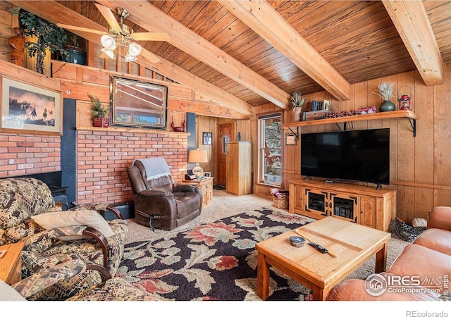 living room with wooden ceiling, lofted ceiling with beams, wooden walls, ceiling fan, and light colored carpet