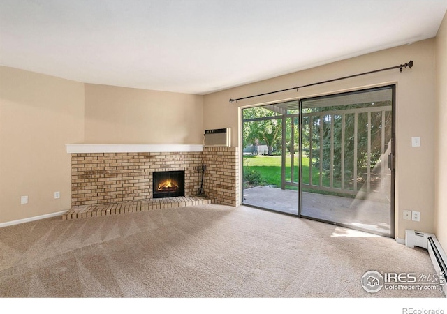 unfurnished living room with carpet floors, a brick fireplace, and a wall mounted AC