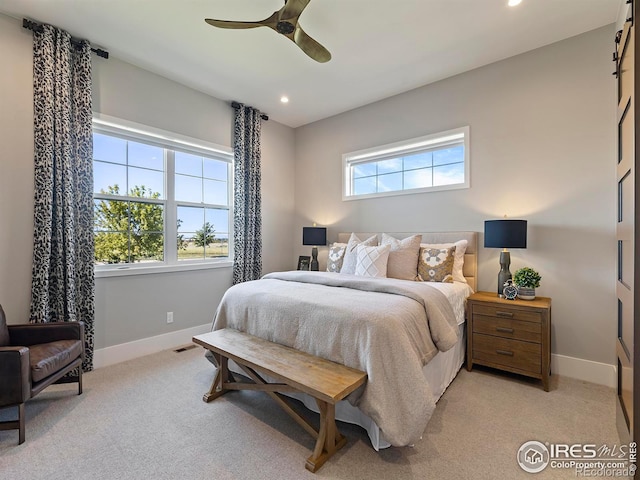 bedroom featuring ceiling fan and light colored carpet