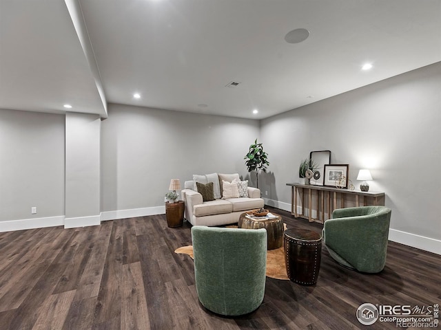 living room with dark hardwood / wood-style flooring