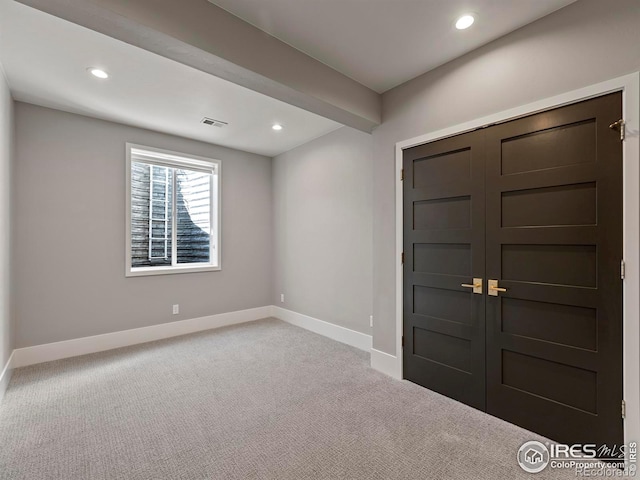 entryway featuring light carpet