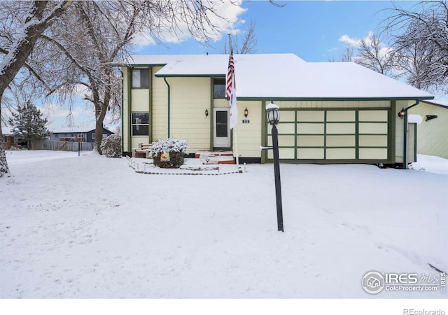 view of front of home with a garage