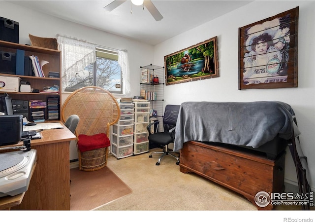 office space with light carpet and ceiling fan