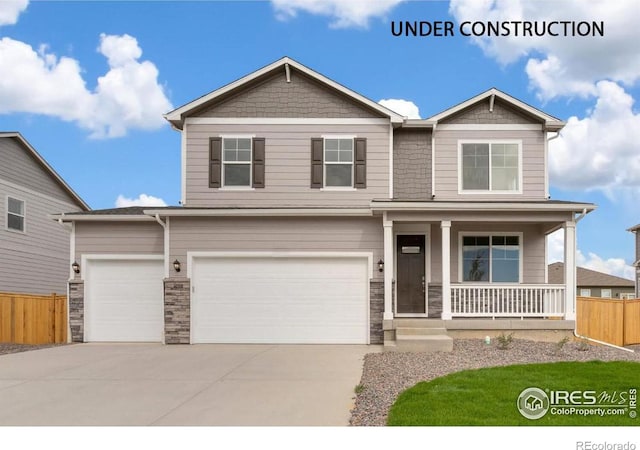 craftsman inspired home featuring a porch and a garage