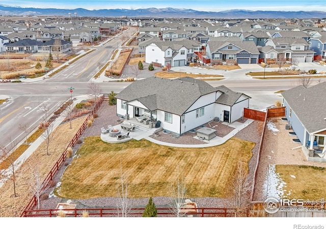 birds eye view of property with a mountain view