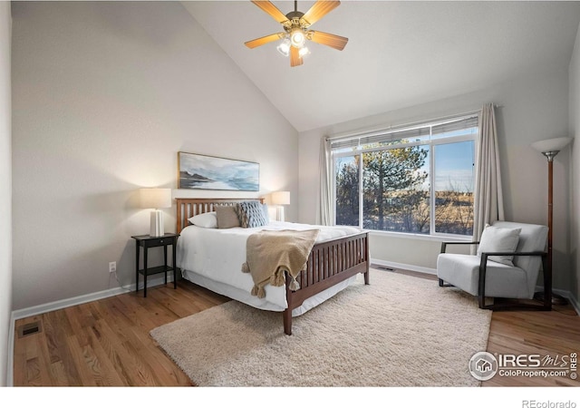 bedroom featuring ceiling fan, high vaulted ceiling, and hardwood / wood-style flooring