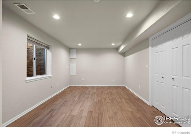 spare room with light hardwood / wood-style floors