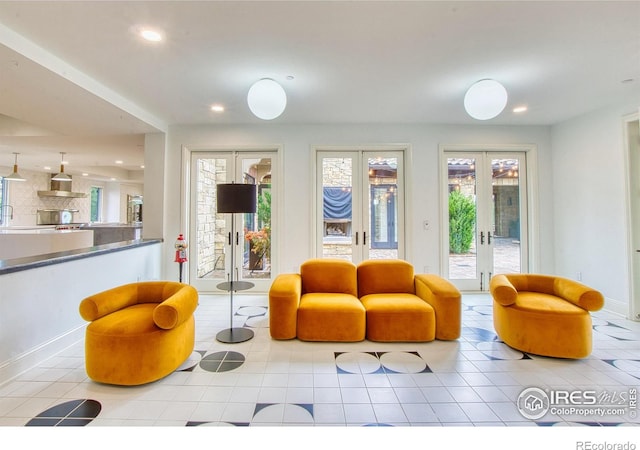 living room with light tile patterned floors and french doors