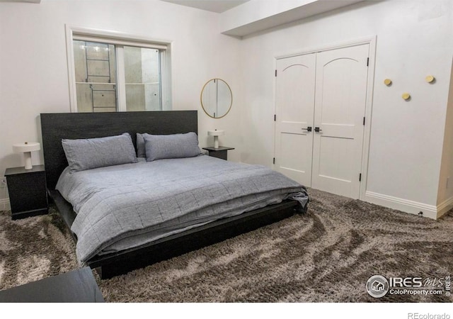 carpeted bedroom with a closet