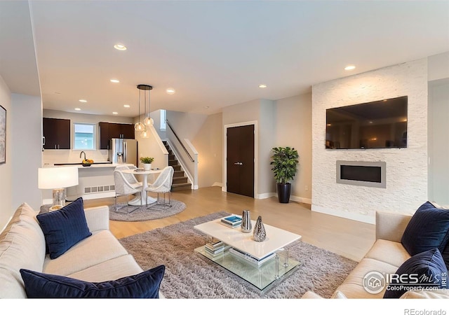 living room with light hardwood / wood-style flooring