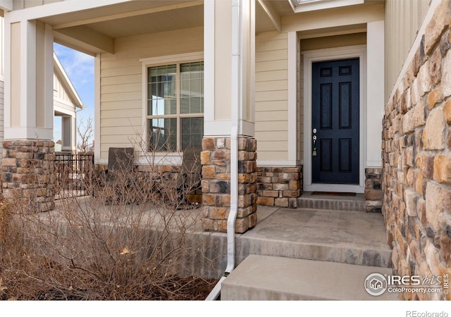 doorway to property with a porch