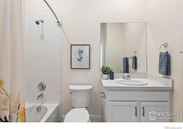 full bathroom featuring shower / bath combo, toilet, and vanity