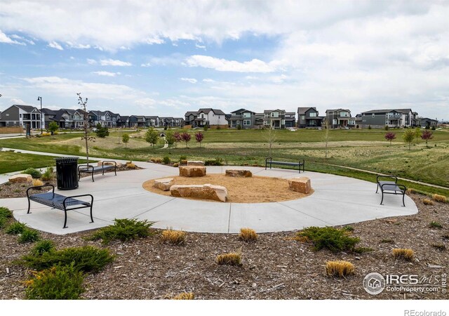 surrounding community featuring a residential view and a yard