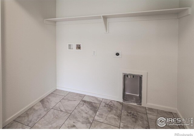 laundry area with laundry area, baseboards, hookup for a washing machine, marble finish floor, and hookup for an electric dryer