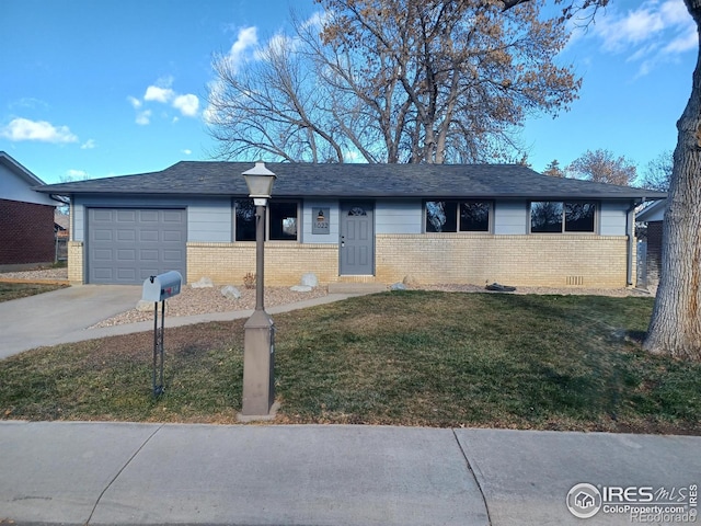 ranch-style house with a front yard and a garage