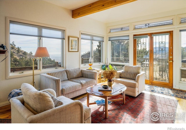 sunroom / solarium with beamed ceiling