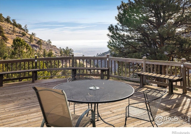 wooden deck featuring a mountain view