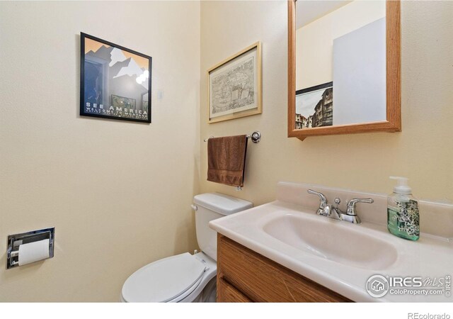 bathroom with vanity and toilet