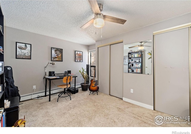 office space with light carpet, a textured ceiling, ceiling fan, and a baseboard heating unit