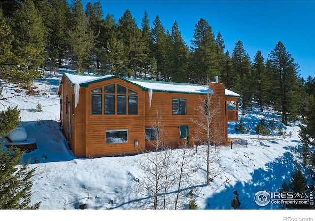 view of snow covered house