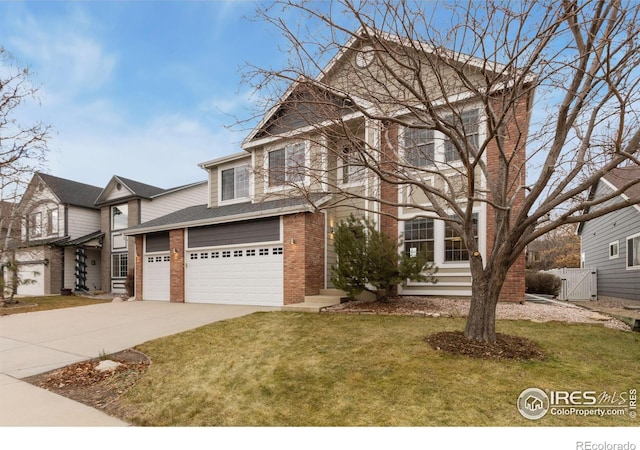 view of front property featuring a garage and a front yard