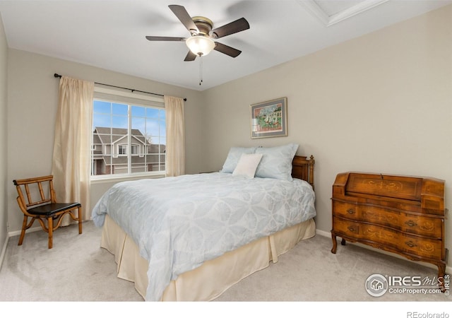 bedroom with light carpet and ceiling fan