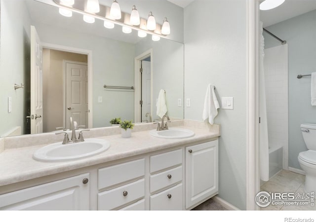 full bathroom featuring tile patterned floors, shower / washtub combination, vanity, and toilet