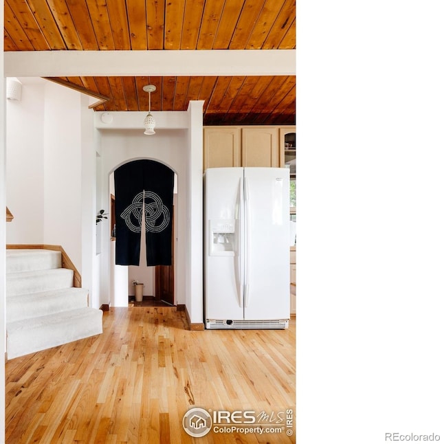 entrance foyer with beamed ceiling, light hardwood / wood-style floors, and wood ceiling