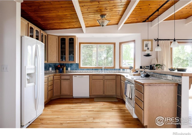 kitchen with beamed ceiling, white appliances, sink, and wood ceiling