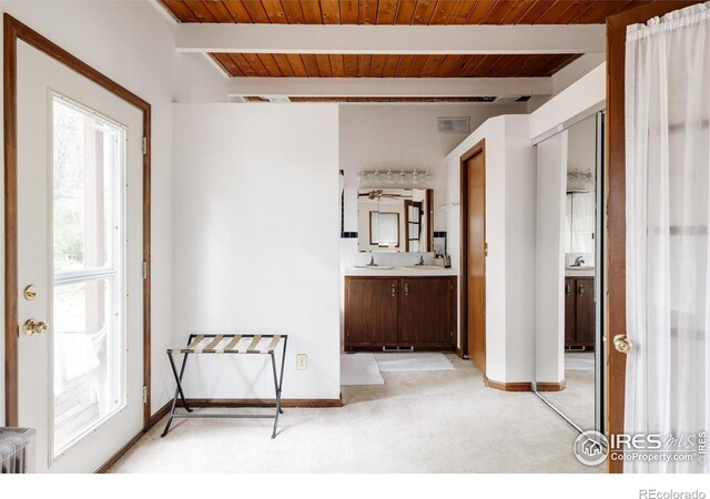 bathroom with vanity, beamed ceiling, wooden ceiling, and radiator