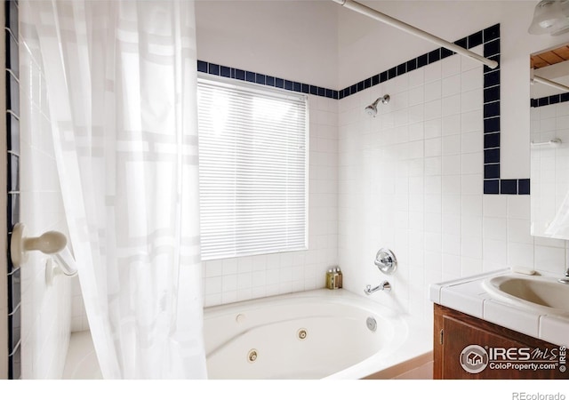 bathroom with shower / tub combo and vanity